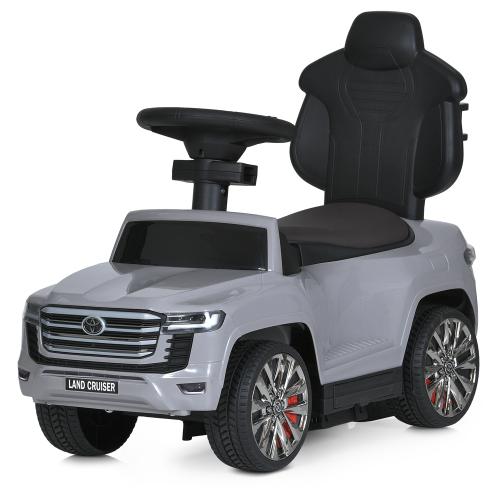 Дитячий толокар-електромобіль Bambi Toyota Land Cruiser 300 (MP3) з батьківською ручкою та пультом керування, сірий